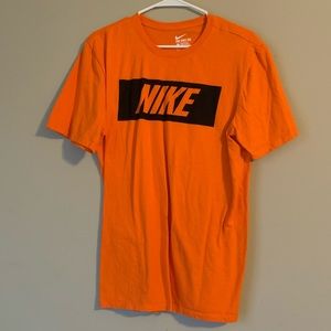 orange Nike shirt
